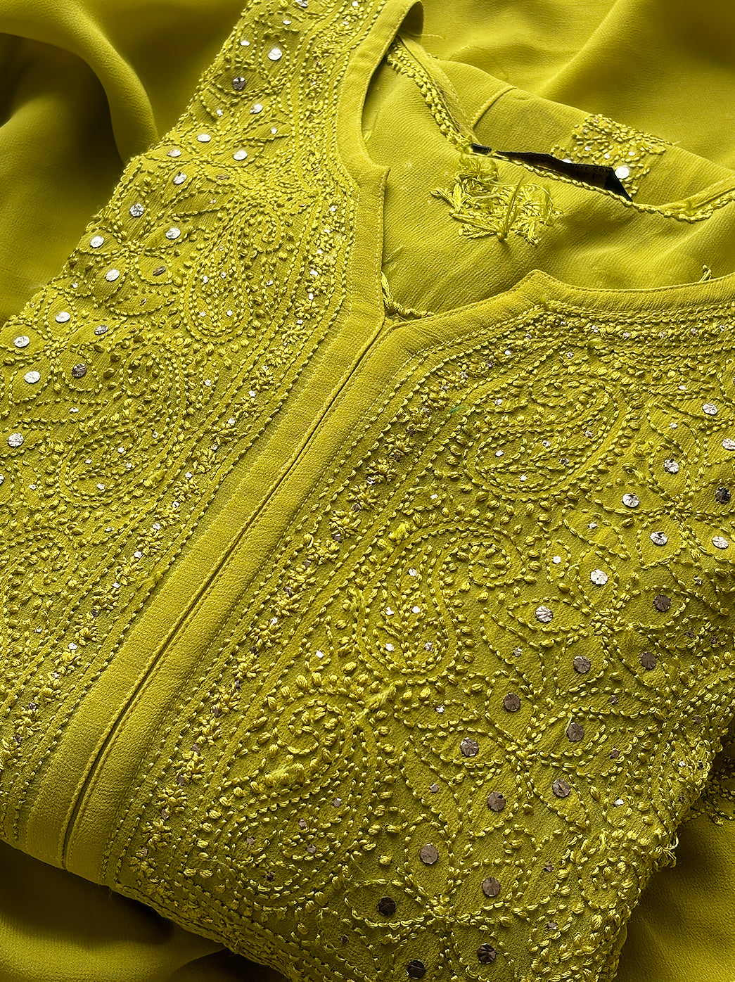 Artisan chikankari kurta featuring delicate bead and mirror embellishments