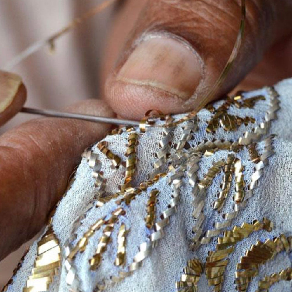 Portrait and hands-at-work photograph of the actual Mukaish kaarigar.