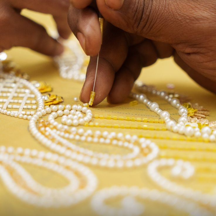 Close-up of the pearl and moti accents on the Beige Mul Chanderi kurta with dupatta.