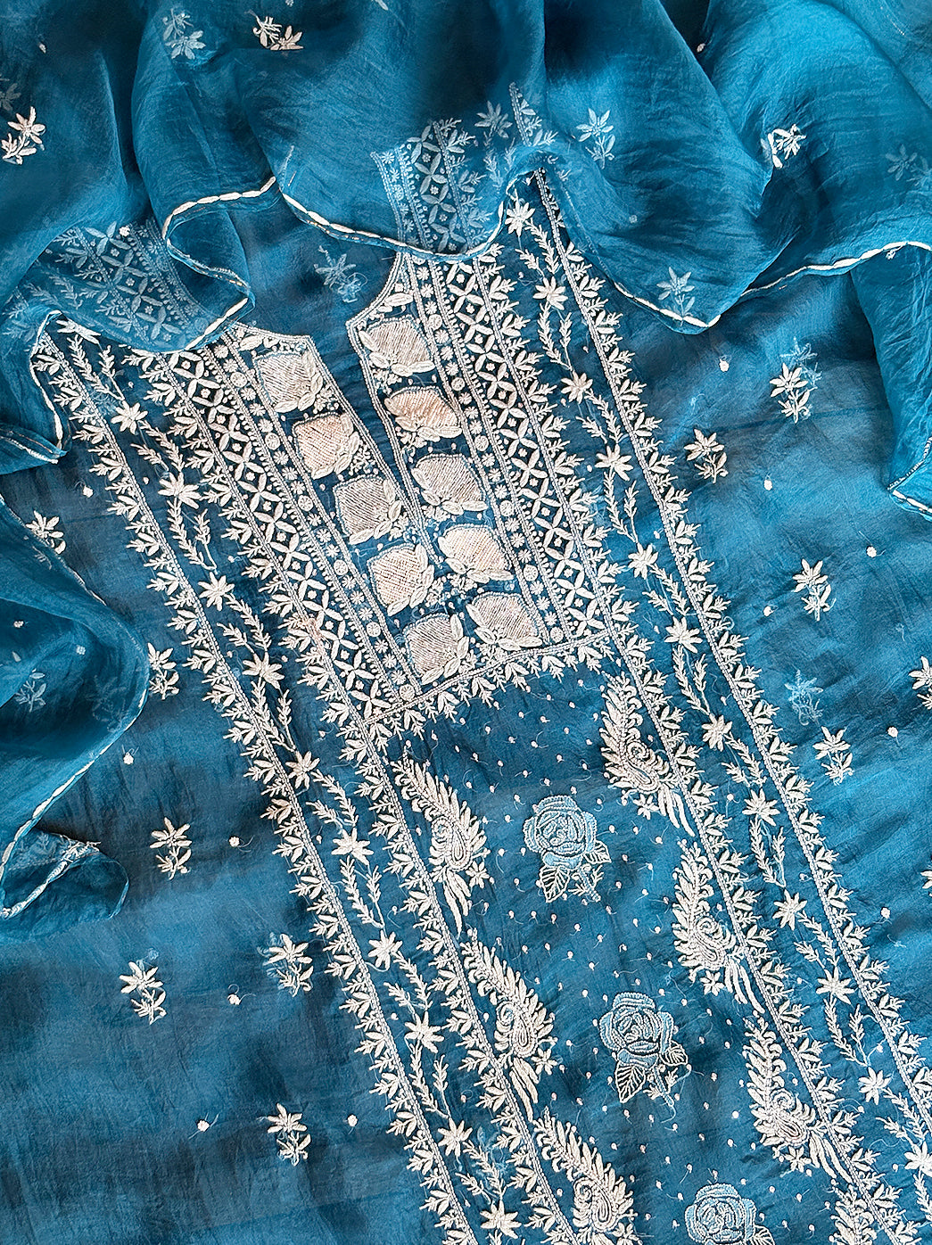 Premium organza kurti material unstitched with hand-embroidered chikankari work and dupatta.