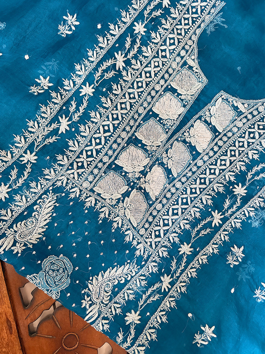 Handcrafted chikankari kurti piece in organza fabric with elegant floral embroidery and dupatta.