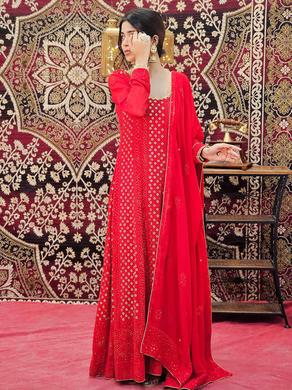 Model twirling in a chikankari anarkali featuring full flare and rich embroidery, styled for a glamorous evening look

