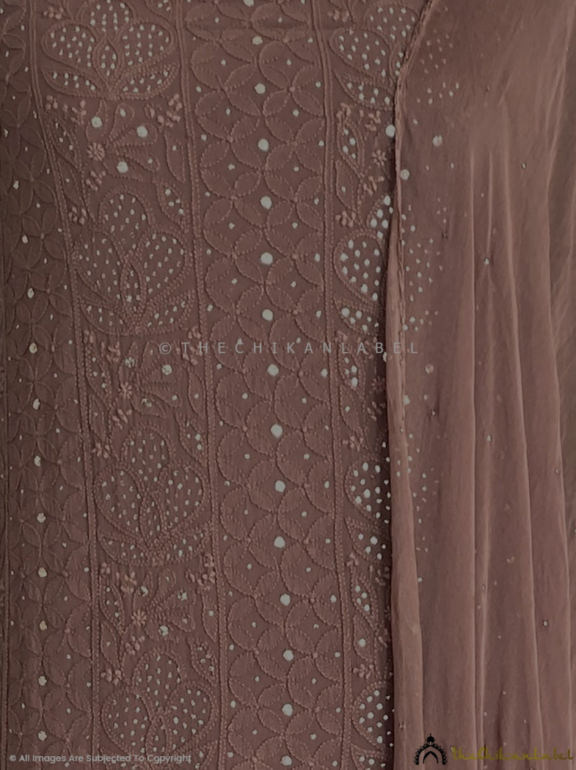 “Close-up of delicate chikankari hand embroidery with mirror embellishments on viscose kurti piece with dupatta”