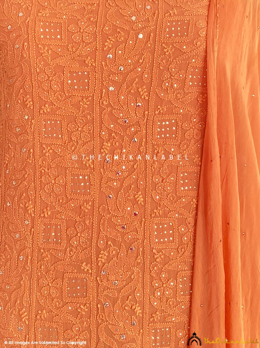 “Close-up of delicate chikankari hand embroidery with mirror embellishments on viscose kurti piece with dupatta”