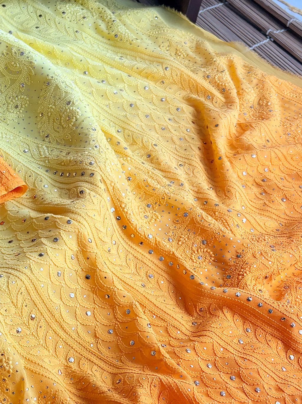 Ethnic saree with heavy hand embroidery, styled gracefully for cultural celebrations or gifting.

