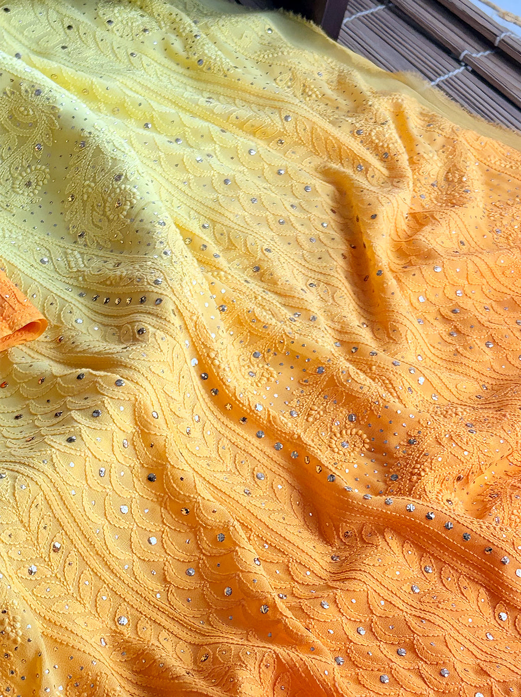 Ethnic saree with heavy hand embroidery, styled gracefully for cultural celebrations or gifting.

