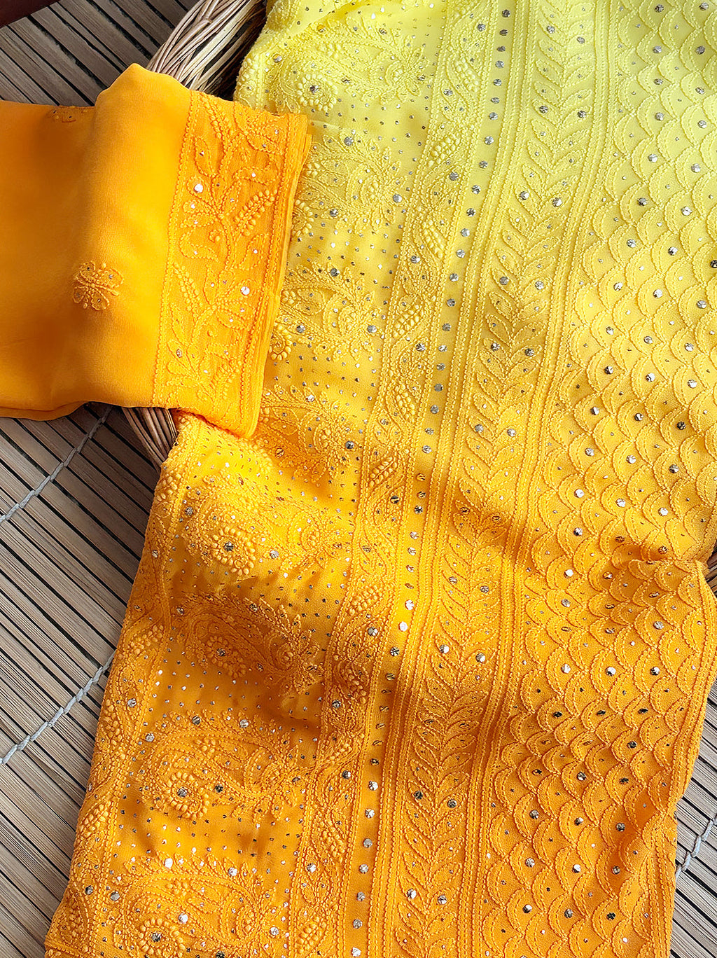 Traditional Indian saree in viscose material with ombre shading and fine handcrafted detailing.

